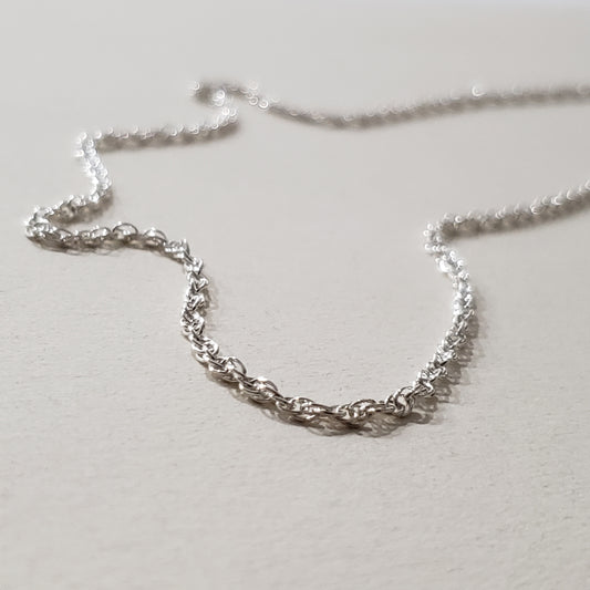 Image of an 18 inch sterling silver rope chain with lobster claw clasp closure.