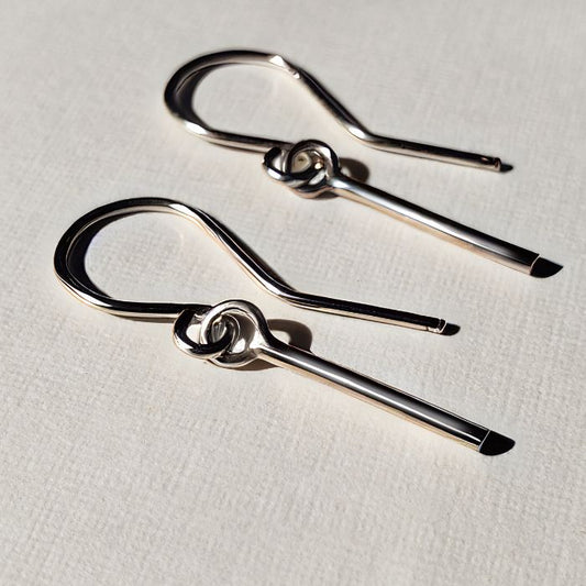 Dainty silver earrings on wires