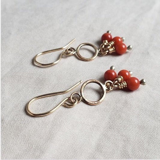 Red coral pom pom earrings
