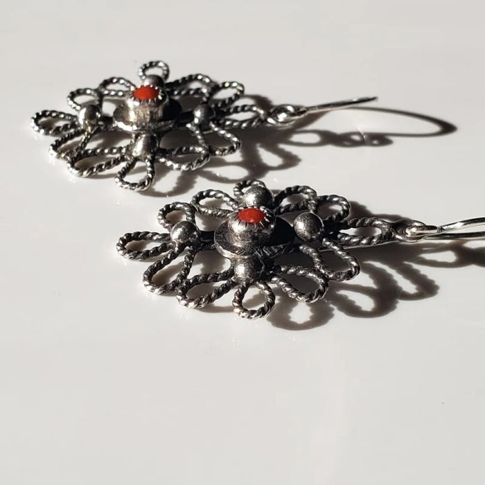 Silver scroll earrings with red coral