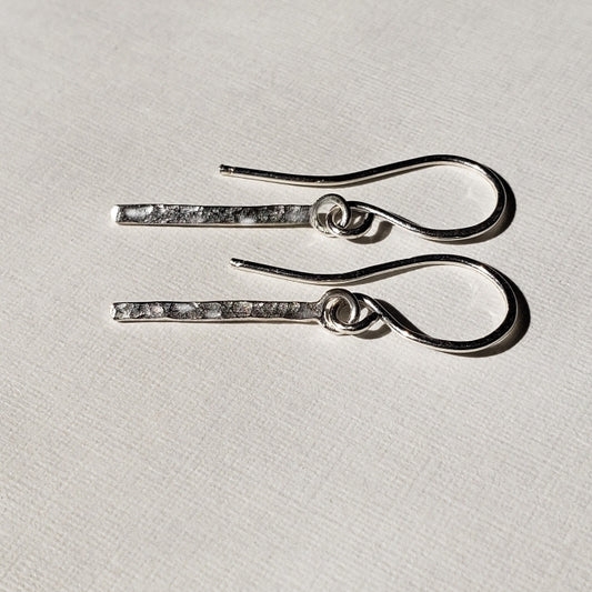 Hammered sterling silver bar earrings hung from wires