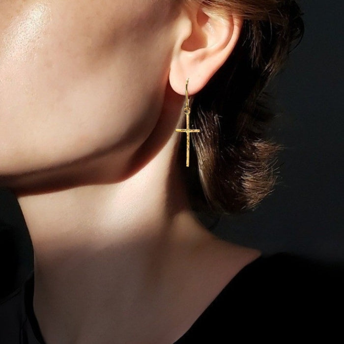 Gold cross earrings with texture