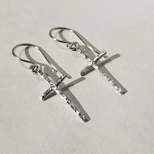 Small hammered silver cross earrings hung on sterling silver wires