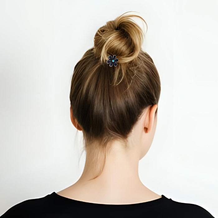 Back of woman's head wearing sterling silver hair flower in hair.