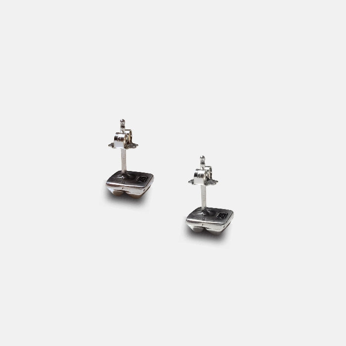 Sterling silver square stud earrings with four raised pyramid facets and post closures