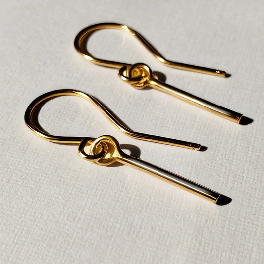 Dainty gold earrings on wires