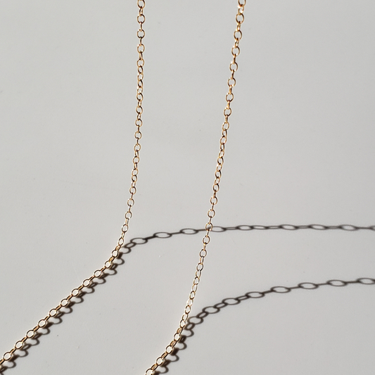 Large link gold chain against white background