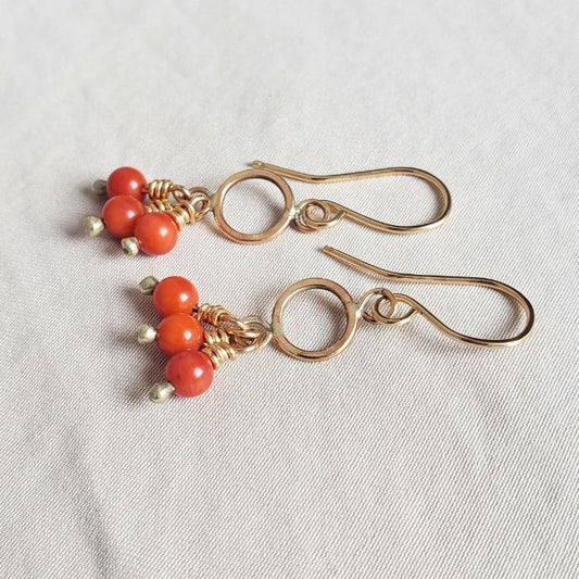 Red coral pom pom earrings