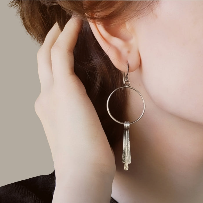 Silver hoop earrings with long dangles