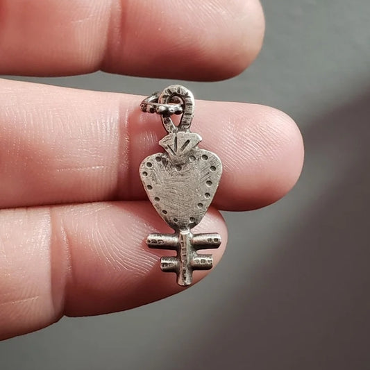 Silver milagros charm pendant