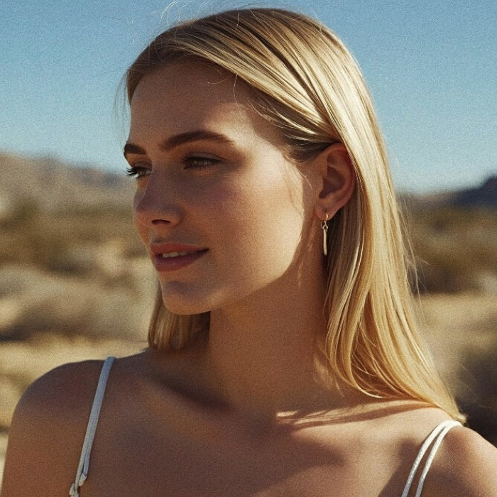 Dainty gold earrings on wires