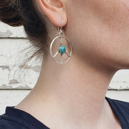 Silver peace sign earrings with turquoise centers