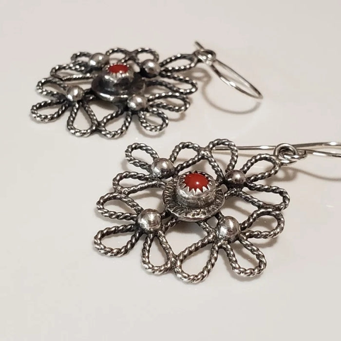 Silver scroll earrings with red coral