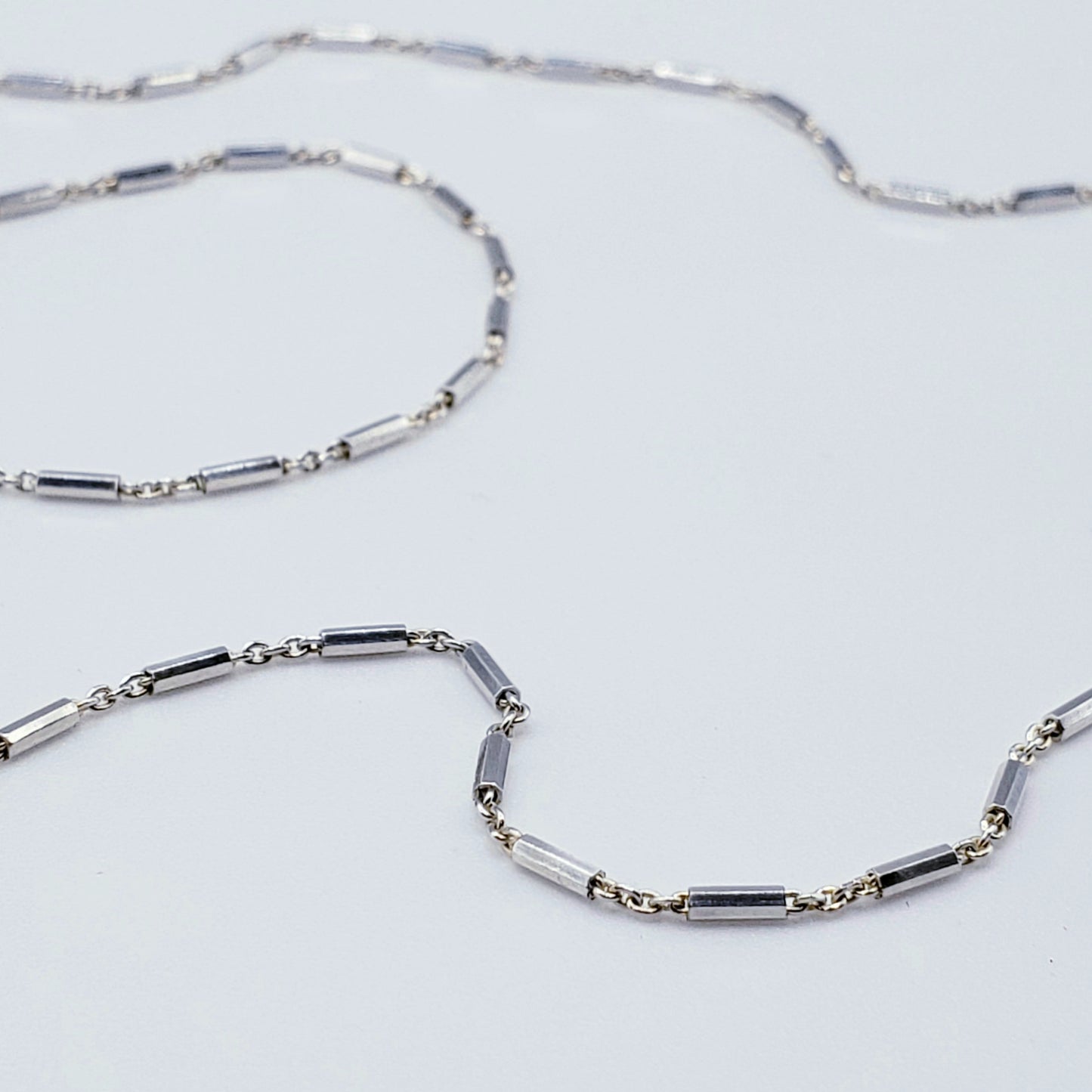 Sterling silver link chain on white background 