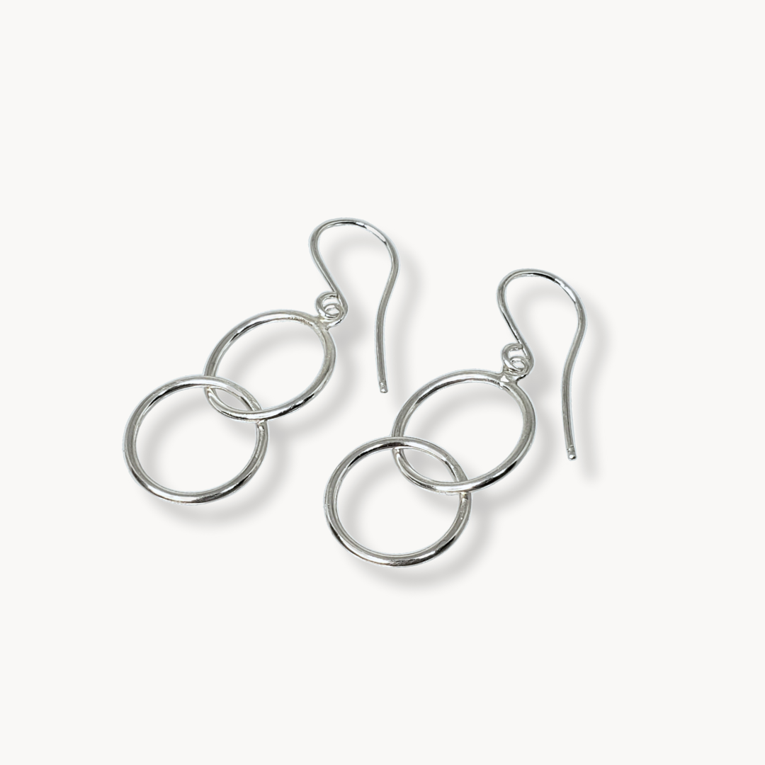 Double hoop earrings against white background