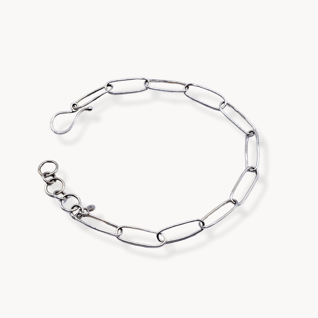 Adjustable silver link bracelet on white background 