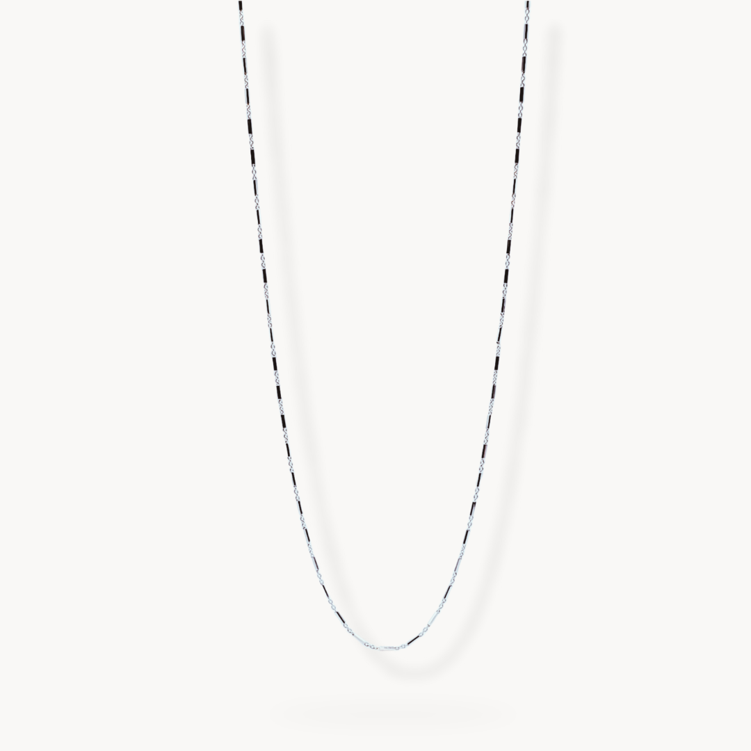 Flat lay image of sterling silver link chain necklace on white background 