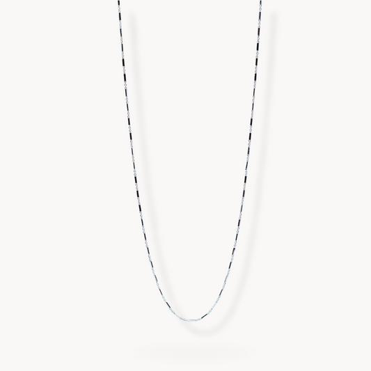 Flat lay image of sterling silver link chain necklace on white background 