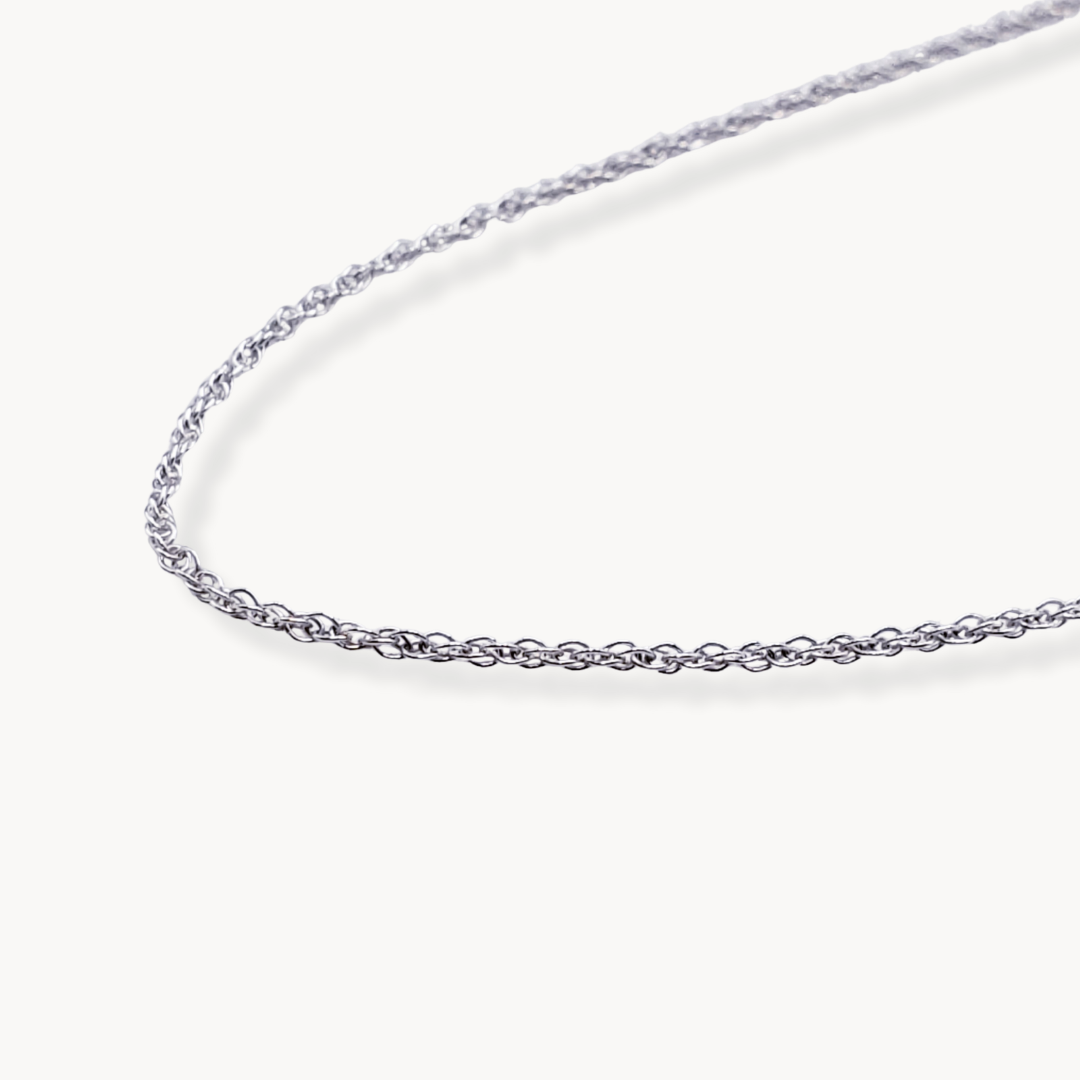 Left facing image of sterling silver chain necklace against white background