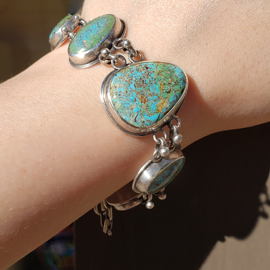 Five stone turquoise bracelet on model wrist 