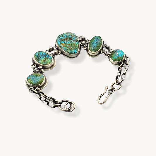 Five stone turquoise bracelet against white background 