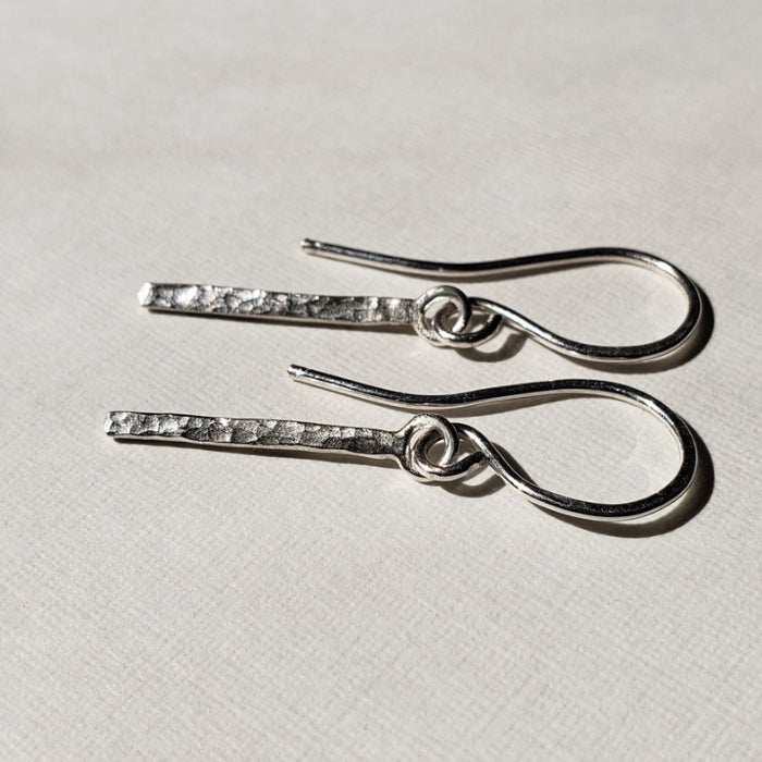 Hammered sterling silver bar earrings hung from wires