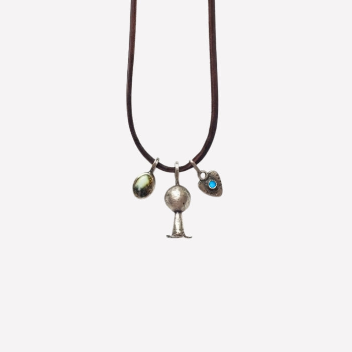 Sterling silver charm necklace on brown cordage