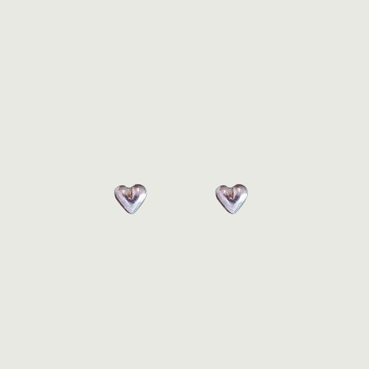 A pair of small puffy heart stud earrings