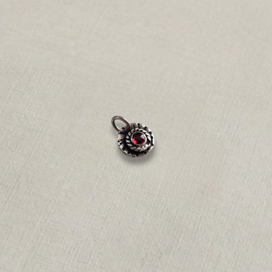 Sterling silver and red garnet charm