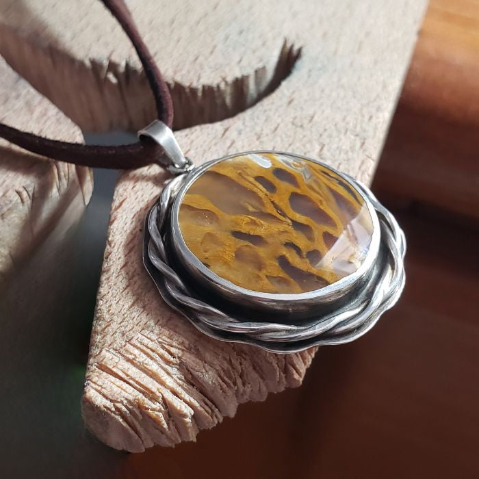 Sterling silver and petrified wood pendant