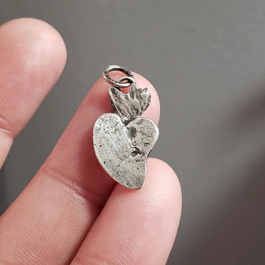 Silver milagros charm pendant