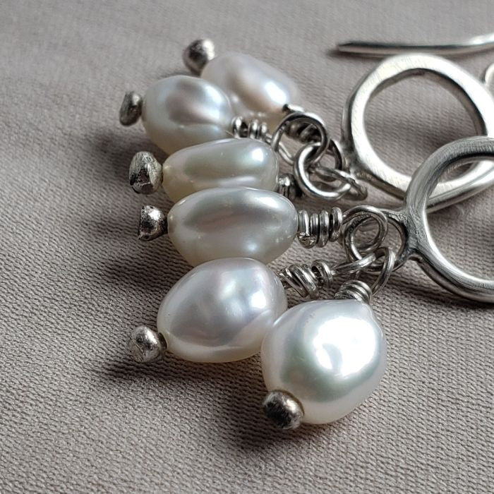 Pearl pom pom earrings
