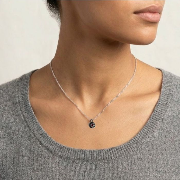 Sterling silver and red garnet charm