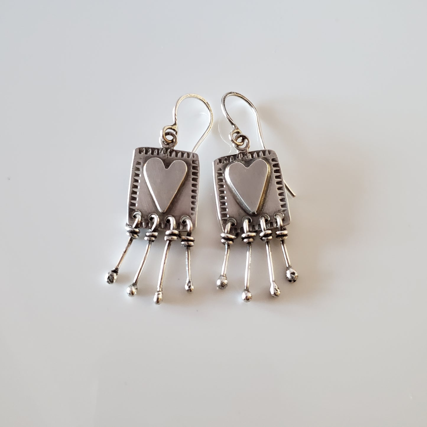 Sterling silver heart dangle earrings