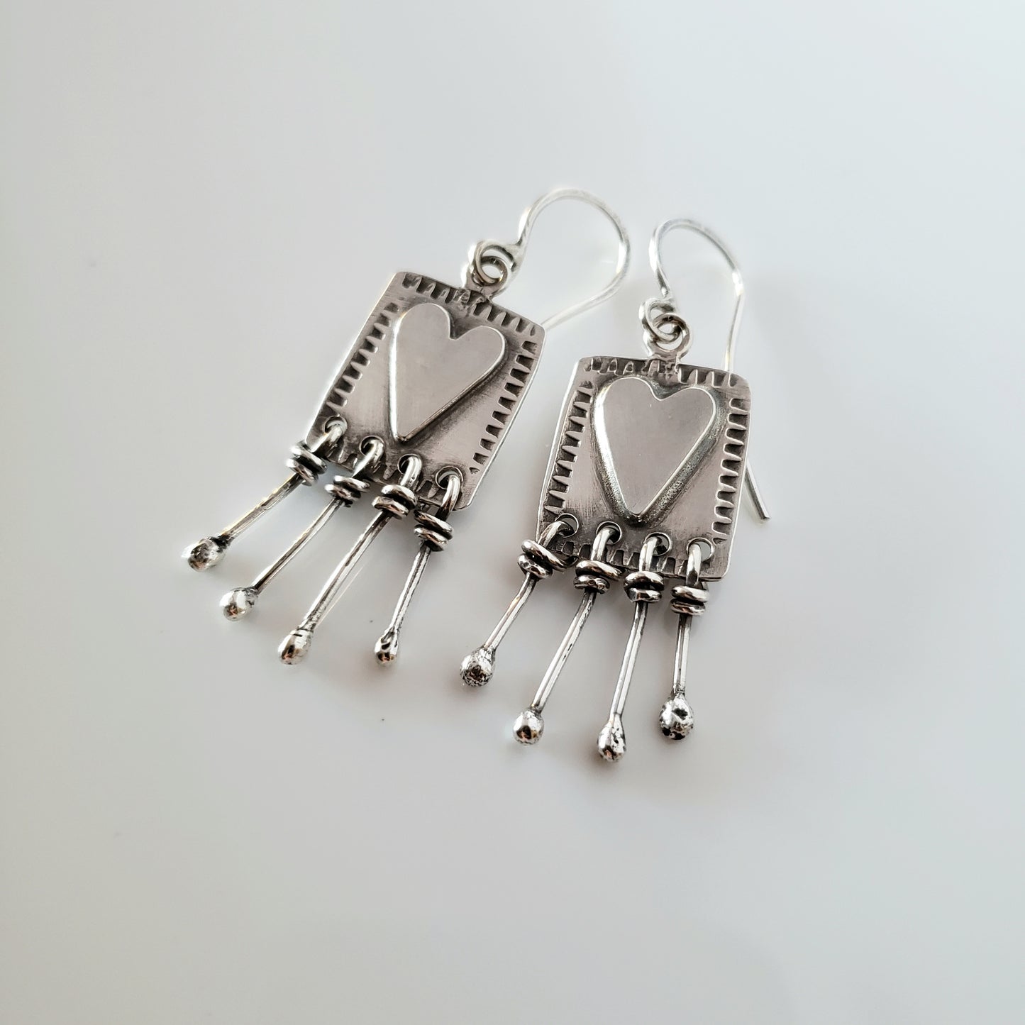 Sterling silver heart dangle earrings
